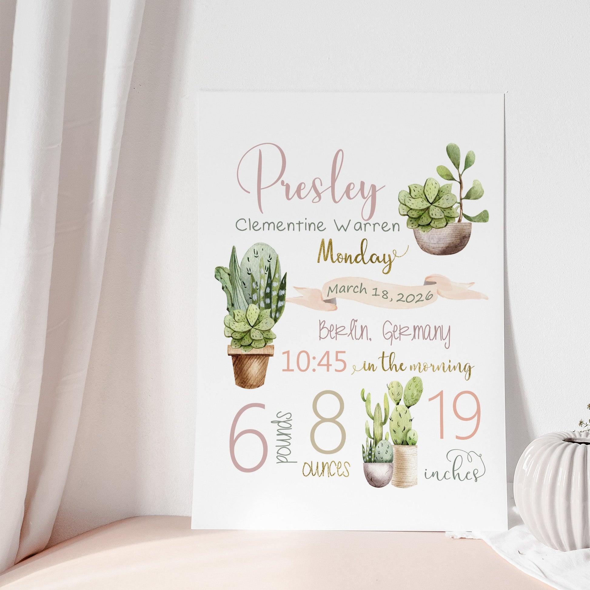 Baby milestone sign with cactus illustrations and text on a white background