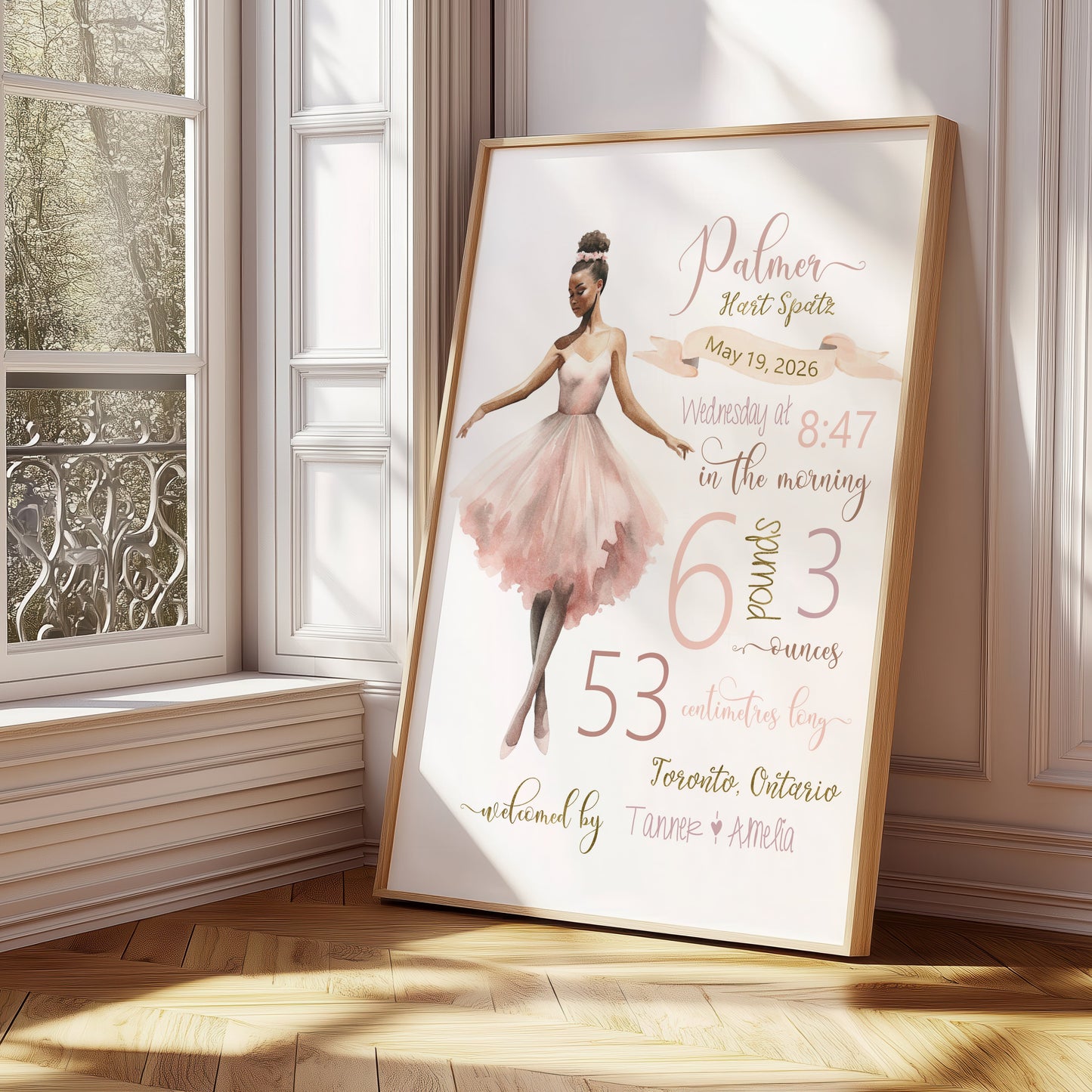 Framed artwork of a ballerina with text on a wall in a bright room.