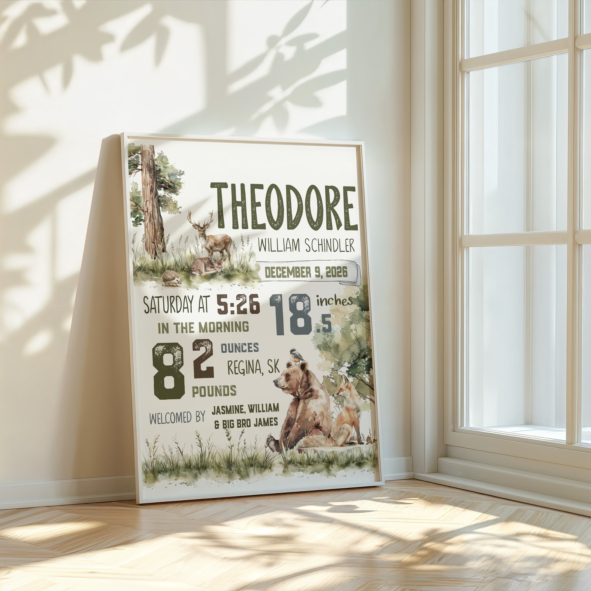 Personalized birth poster with bear design in a room with sunlight filtering through a window.